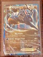 Front view of Kingdra EX card showing artwork, HP 170, attacks, foil pattern