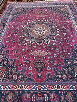 Full view of Mashad rug displaying overall field and borders