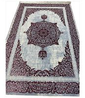 Full view of rectangular purple medallion rug on sky blue field