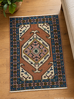 Full view of Ardabil rug on wood floor