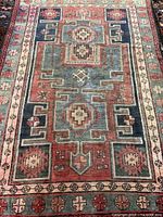 Full view of the Zanjan rug showing overall pattern and colour palette