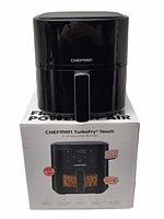 Front view of Chefman TurboFry Touch air fryer sitting on its retail box