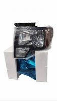 Pair of headlight assemblies in foam packaging