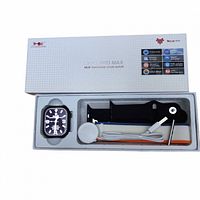 Opened box showing smartwatch, straps, charger, tool