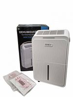 Front view of KNKA dehumidifier with box and sealed paperwork