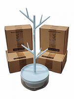 One assembled light blue branch jewelry rack in front of three sealed Half Room Branch Jewelry Rack boxes