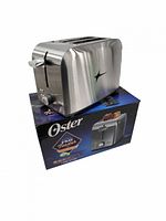 Oster stainless steel 2-slice toaster atop original box