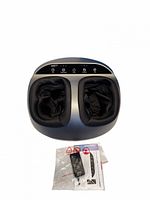 Top view of RENPHO foot massager showing control panel and dual foot chambers with fabric liners, manual and remote in plastic bag visible