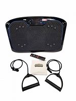 Vibration plate with accessories laid out: remote, manual, two resistance bands