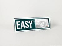 Front view showing full sign and photo window