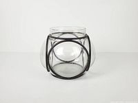 front view of glass bowl within iron frame