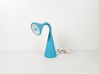 Full view of lamp showing conical base, flexible neck, lamp head, USB cord