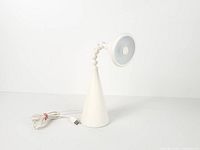 Front view of IKEA Fryebo desk lamp showing conical base, gooseneck, USB cable