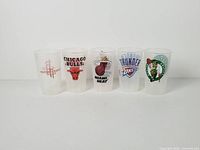 Front view of all five frosted plastic NBA cups