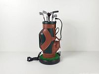 Front view of golf bag telephone with decorative clubs