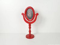 Full view of red wood tilting table mirror