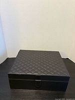 Top and front view of quilted faux leather box