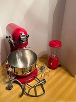 KitchenAid stand mixer with stainless bowl and three attachments, plus Hamilton Beach blender