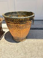 Round hammered planter front view showing texture and rim