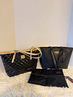 Group shot showing both totes and clutch pouch