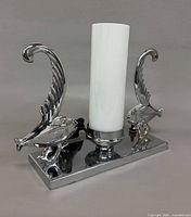 Front view of chrome fish lamp unlit