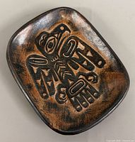 Front of dish showing Haida eagle motif