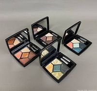 Four open Dior 5 Couleurs palettes showing shade combinations and applicators