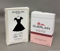 Both boxed perfumes side by side