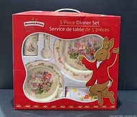 Front of boxed Bunnykins 5-piece dinner set showing contents through window