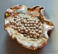 Front view showing leaf shape and grape cluster detail