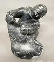 Front view of signed Inuit soapstone seal hunter sculpture