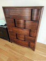 Full view of front of five-drawer highboy dresser