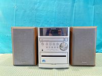Front view of Aiwa XR-EM50 stereo with both speakers positioned on either side
