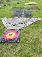 Three laid-out nets and a rolled net showing colors and styles