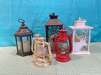 Front view of five assorted lanterns