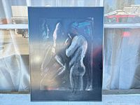 Front view of framed Markowsky artwork showing two-figure composition and frame