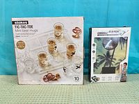 Stokes Tic-Tac-Toe and Soar cornhole boxes side by side
