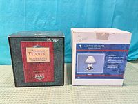 Both boxed items: PowerPlay Teddies bank and Lighting Concepts lamp