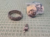 Bracelet, bagged door knob set, owl pendant on fabric mat