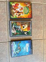 Front covers of the three Disney cases: The Fox and the Hound, Bambi, Finding Nemo