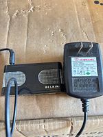 Belkin hub connected to Coming Data AC adapter showing both items