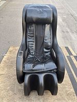 Front view of black BestMassage massage chair showing overall design and foot/calf wells