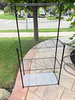Full frontal view of four-shelf black wire rack