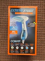 Front of retail box showing Conair Extreme Steam handheld steamer image and specifications