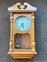 Front view of oak-finish Daniel Dakota wall clock