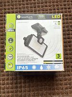 Front of boxed Good Earth LED motion security light showing branding, features and IP65 rating