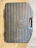Closed black plastic case embossed Gourmet Traditions logo