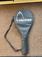HEAD branded black racket case with strap