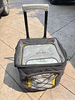 Front view showing cooler, handle extended, overall wear