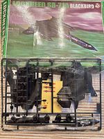 Sprue layout with model parts, decal sheet and worn SR-71A box artwork
